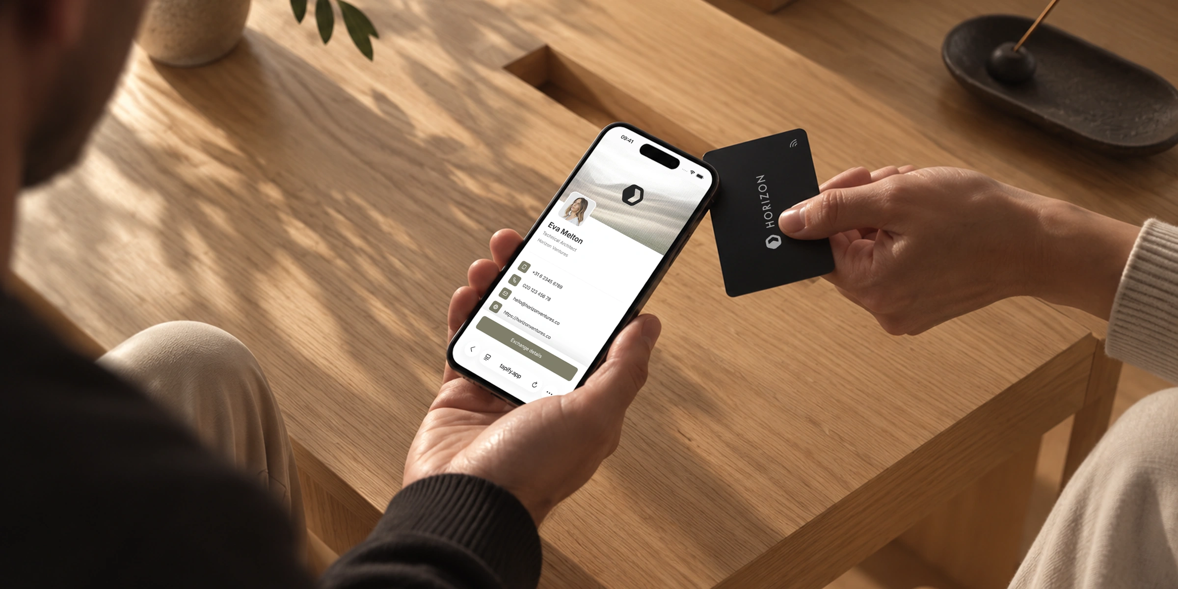 Person sharing a Tapify digital business card with an NFC Card